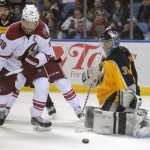 Arizona Coyotes right winger Shane Doan (19) eyes a rebound from Buffalo Sabres goaltender Matt Hackett (31) during the second period of an NHL hockey game Thursday, March 26, 2015, in Buffalo, N.Y. (AP Photo/Gary Wiepert)