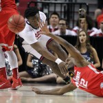 Arizona forward Stanley Johnson, left, steals the ball from Ohio State forward Sam Thompson during an NCAA college basketball tournament round of 32 game in Portland, Ore., Saturday, March 21, 2015. (AP Photo/Craig Mitchelldyer)