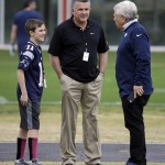 New England Patriots owner Robert Kraft, right, greets Arizona State head football coach Todd Graham, center, and Graham's son, Michael, during a Patriots' practice Thursday, Jan. 29, 2015, in Tempe, Ariz. The Patriots play the Seattle Seahawks in NFL football Super Bowl XLIX Sunday, Feb. 1. (AP Photo/Mark Humphrey)