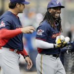 National League Manager Mike Matheny, left, of the St. Louis Cardinals, talks with outfielder Andrew McCutchen, of the Pittsburgh Pirates, during batting practice for the MLB All-Star baseball game, Monday, July 14, 2014, in Minneapolis. (AP Photo/Jeff Roberson)