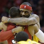 Cleveland Cavaliers forward LeBron James, right, hugs Miami Heat guard Dwyane Wade before an NBA basketball game, Thursday, Dec. 25, 2014, in Miami. (AP Photo/Lynne Sladky)