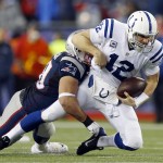 Indianapolis Colts quarterback Andrew Luck is tackled by New England Patriots defensive end Rob Ninkovich during the first half of the NFL football AFC Championship game Sunday, Jan. 18, 2015, in Foxborough, Mass. (AP Photo/Julio Cortez)