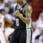 San Antonio Spurs guard Patty Mills (8) gestures after scoring two points during the first half in Game 3 of the NBA basketball finals against the Miami Heat, Tuesday, June 10, 2014, in Miami. (AP Photo/Wilfredo Lee)