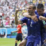  Bosnia's Avdija Vrsajevic (2) celebrates with teammate Vedad Ibisevic after scoring his team's third goal during the group F World Cup soccer match between Bosnia and Iran at the Arena Fonte Nova in Salvador, Brazil, Wednesday, June 25, 2014. (AP Photo/Martin Mejia)