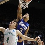 Hampton's Quinton Chievous (3) dunks on Manhattan's Zane Waterman (4) in the second half of a first round NCAA tournament basketball game Tuesday, March 17, 2015 in Dayton, Ohio. (AP Photo/Skip Peterson)