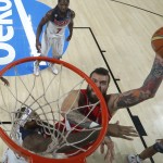 Serbia's Miroslav Raduljica pushes the ball up the basket during the final World Basketball match between the United States and Serbia at the Palacio de los Deportes stadium in Madrid, Spain, Sunday, Sept. 14, 2014. (AP Photo/Daniel Ochoa de Olza)