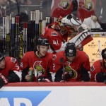 Ottawa Senators players sit on the bench during third period of Game 6 of a first-round NHL hockey playoff series against the Montreal Canadiens, Sunday April 26, 2015, in Ottawa, Ontario. The Canadiens defeated the Senators 2-0 to advance to the second round of the NHL playoffs. (Adrian Wyld/The Canadian Press via AP)