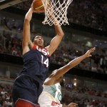 United States' Anthony Davis (14), of the New Orleans Pelicans, dunks over Brazil's Leandro Barbosa, of the Phoenix Suns, during the first half of an exhibition basketball game Saturday, Aug. 16, 2014, in Chicago. (AP Photo/Charles Rex Arbogast)