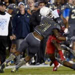 Arizona running back Terris Jones-Grigsby, right, is tackled by UCLA defensive back Tahaan Goodman (21) during the first half of an NCAA college football game, Saturday, Nov. 1, 2014, in Pasadena, Calif. (AP Photo/Gus Ruelas)
