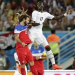 United States' Kyle Beckerman, left, goes up against Ghana's Mohammed Rabiu for a header during the group G World Cup soccer match between Ghana and the United States at the Arena das Dunas in Natal, Brazil, Monday, June 16, 2014. (AP Photo/Petr David Josek)