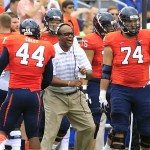 Virginia head coach Mike London, center, reacts to a play with linebacker Henry Coley (44) and guard Conner Davis (74) during the first half of an NCAA college football game against UCLA at Scott Stadium, Saturday, Aug. 30, 2014, in Charlottesville, Va. (AP Photo/Andrew Shurtleff)