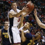 Arizona's Kaleb Tarczewski grabs a rebound over California's David Kravish, left, Arizona's Brandon Ashley, second from right, and California's Jordan Mathews, right, in the second half of an NCAA college basketball game in the quarterfinals of the Pac-12 conference tournament Thursday, March 12, 2015, in Las Vegas. (AP Photo/John Locher)