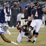 Dallas Cowboys' Barry Church (42) blocks an extra point kicked by Chicago Bears kicker Jay Feely (4) during the second half of an NFL football game Thursday, Dec. 4, 2014, in Chicago. (AP Photo/Charles Rex Arbogast)