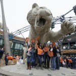 Baseball fans are photographed with the Detroit Tigers mascot statue before entering Comerica Park for an opening day baseball game between the Detroit Tigers and the Minnesota Twins in Detroit, Monday, April 6, 2015. (AP Photo/Carlos Osorio)