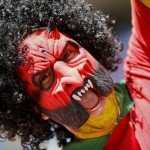 A Belgium supporter shouts out before the World Cup quarterfinal soccer match between Argentina and Belgium at the Estadio Nacional in Brasilia, Brazil, Saturday, July 5, 2014. (AP Photo/Frank Augstein)