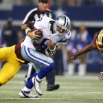 Washington Redskins inside linebacker Perry Riley, left, sacks Dallas Cowboys quarterback Tony Romo (9) as free safety Ryan Clark, right, comes over to help during the first half of an NFL football game, Monday, Oct. 27, 2014, in Arlington, Texas. (AP Photo/Tim Sharp)