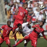 Panama's Alfredo Stephens, top, heads the ball against United States' Miguel Ibarra, center, as Panama's Leonel Parris, left, and Marcos Sanchez watch during the first half of a friendly soccer match, Sunday, Feb. 8, 2015, in Carson, Calif. (AP Photo/Jae C. Hong)