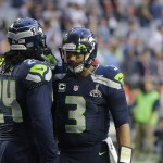 Seattle Seahawks running back Marshawn Lynch (24) and quarterback Russell Wilson (3) warm up before the NFL Super Bowl XLIX football game against the New England Patriots on Sunday, Feb. 1, 2015, in Glendale, Ariz. (AP Photo/Kathy Willens)