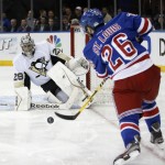  New York Rangers right wing Martin St. Louis (26) takes a shot on Pittsburgh Penguins goalie Marc-Andre Fleury (29) in the second period of their second-round NHL Stanley Cup hockey playoff game at Madison Square Garden in New York, Monday, May 5, 2014. (AP Photo/Kathy Willens)