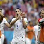 United States' Clint Dempsey, center, and his teammates applaud after qualifying for the next World Cup round following their 1-0 loss to Germany during the group G World Cup soccer match between the USA and Germany at the Arena Pernambuco in Recife, Brazil, Thursday, June 26, 2014. (AP Photo/Ricardo Mazalan)