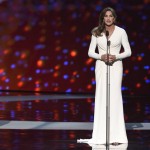 Soccer player Abby Wambach, of the United States women's national soccer team, left, looks on as Caitlyn Jenner accepts the Arthur Ashe award for courage at the ESPY Awards at the Microsoft Theater on Wednesday, July 15, 2015, in Los Angeles. (Photo by Chris Pizzello/Invision/AP)