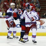 Washington Capitals left wing Alex Ovechkin (8), from Russia, gets tangled up with New York Rangers defenseman Dan Girardi (5) during the first period of Game 3 in the second round of the NHL Stanley Cup hockey playoffs, Monday, May 4, 2015, in Washington. (AP Photo/Alex Brandon)