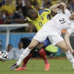  France's Laurent Koscielny, right, and Ecuador's Enner Valencia challenge for the ball during the group E World Cup soccer match between Ecuador and France at the Maracana Stadium in Rio de Janeiro, Brazil, Wednesday, June 25, 2014. (AP Photo/Christophe Ena)