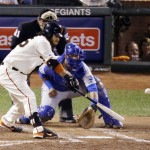 San Francisco Giants' Brandon Crawford hits an RBI single to score Pablo Sandoval during the fourth inning of Game 5 of baseball's World Series against the Kansas City Royals on Sunday, Oct. 26, 2014, in San Francisco. (AP Photo/Charlie Riedel)