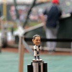 A bobblehead of New York Yankees great Lou Gehrig stands on a stanchion during the Yankees batting practice prior to a baseball game against the Minnesota Twins, Friday, July 4, 2014, in Minneapolis. The Yankees are commemorating the 75th anniversary of Gehrig's famous farewell speech. (AP Photo/Jim Mone)