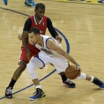  Golden State Warriors shooting guard Stephen Curry, bottom, drives against Los Angeles Clippers guard Chris Paul during the first quarter of Game 6 of an opening-round NBA basketball playoff series in Oakland, Calif., Thursday, May 1, 2014. (AP Photo/Jeff Chiu)