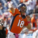 Denver Broncos quarterback Peyton Manning (18) warms up prior to an NFL football game against the Arizona Cardinals, Sunday, Oct. 5, 2014, in Denver. (AP Photo/Jack Dempsey)