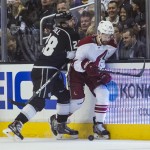  Los Angeles Kings forward Jarret Stoll (28) and Phoenix Coyotes defenseman Chris Summers (20) works along the boards during the first period of an NHL hockey game, Wednesday, April 2, 2014, in Los Angeles. (AP Photo/Ringo H.W. Chiu)