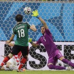 Mexico's Andres Guardado scores his side's second goal during the group A World Cup soccer match between Croatia and Mexico at the Arena Pernambuco in Recife, Brazil, Monday, June 23, 2014. (AP Photo/Sergei Grits)