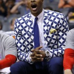 An injured Houston Rockets' Dwight Howard shouts jokingly at officials during the second half of an NBA basketball game against the Phoenix Suns Tuesday, Feb. 10, 2015, in Phoenix. The Rockets won 127-118. (AP Photo/Ross D. Franklin)
