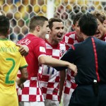 Croatia players argue with referee Yuichi Nishimura from Japan after being given a penalty during the group A World Cup soccer match between Brazil and Croatia, the opening game of the tournament, in the Itaquerao Stadium in Sao Paulo, Brazil, Thursday, June 12, 2014. (AP Photo/Ivan Sekretarev)