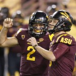 Arizona State's Zane Gonzalez, right, celebrates his game-winning field goal against Utah with teammate Mike Bercovici (2) in overtime of an NCAA college football game on Saturday, Nov. 1, 2014, in Tempe, Ariz. Arizona State defeated the Utah 19-16 in overtime. (Photo/Ross D. Franklin)