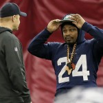 Seattle Seahawks' Marshawn Lynch adjusts his cap during a team practice for NFL Super Bowl XLIX football game, Friday, Jan. 30, 2015, in Tempe, Ariz. The Seahawks play the New England Patriots in Super Bowl XLIX on Sunday, Feb. 1, 2015. (AP Photo/Matt York)