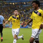 Colombia's James Rodriguez (10) celebrates with his teammate Juan Cuadrado (11) after he scored his side's second goal during the World Cup round of 16 soccer match between Colombia and Uruguay at the Maracana Stadium in Rio de Janeiro, Brazil, Saturday, June 28, 2014. (AP Photo/Marcio Jose Sanchez)