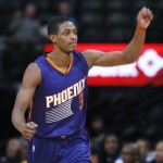 Phoenix Suns guard Brandon Knight reacts after hitting a 3-point basket against the Denver Nuggets late in the fourth quarter of an NBA basketball game Wednesday, Feb. 25, 2015, in Denver. The Suns won 110-96. (AP Photo/David Zalubowski)