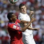 England's James Milner, right, and Costa Rica's Junior Diaz go for a header during the group D World Cup soccer match between Costa Rica and England at the Mineirao Stadium in Belo Horizonte, Brazil, Tuesday, June 24, 2014. (AP Photo/Fernando Vergara)