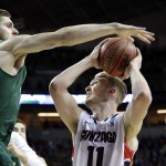 North Dakota State's Chris Kading, left, tries to block a shot by Gonzaga's Domantas Sabonis during the first half of an NCAA tournament college basketball game in the Round of 64 in Seattle, Friday, March 20, 2015. (AP Photo/Elaine Thompson)