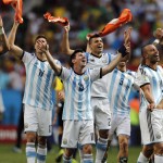  Argentina's Lionel Messi and teammates celebrate at the end of the World Cup quarterfinal soccer match between Argentina and Belgium at the Estadio Nacional in Brasilia, Brazil, Saturday, July 5, 2014. Argentina won 1-0. (AP Photo/Eraldo Peres)