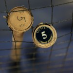 Milwaukee Brewers shortstop Hector Gomezs' bats sit against the dugout net before the start of an opening day baseball game between the Milwaukee Brewers and the Colorado Rockies Monday, April 6, 2015 in Milwaukee. (AP Photo/Darren Hauck)