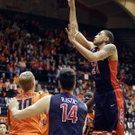 Arizona forward Brandon Ashley, right, shoots over teammate Dusam Ristic (14) and Oregon State forward Olaf Schaftenaar during the first half of an NCAA college basketball game in Corvallis, Ore., Sunday, Jan. 11, 2015. (AP Photo/Don Ryan)
