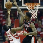Houston Rockets' James Harden (13) has his shot blocked by Portland Trail Blazers' Thomas Robinson (41) during the first half in Game 2 of an opening-round NBA basketball playoff series Wednesday, April 23, 2014, in Houston. (AP Photo/David J. Phillip)
