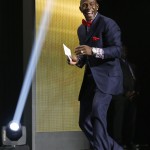 Former Green Bay Packers wide receiver Donald Driver smiles as he walks on the stage to announce that the Packers selects Miami of Ohio defensive back Quinten Rollins as the 62nd pick in the second round of the 2015 NFL Football Draft, Friday, May 1, 2015, in Chicago. (AP Photo/Charles Rex Arbogast)
