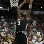 Chicago Bulls' Bobby Portis dunks against the Phoenix Suns during the second half of an NBA summer league basketball game Saturday, July 18, 2015, in Las Vegas. (AP Photo/John Locher)
