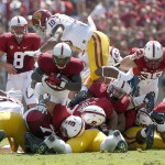 Stanford running back Barry Sanders (26) dives for a first down under Southern California linebacker Hayes Pullard (10) during the first half of an NCAA college football game on Saturday, Sept. 6, 2014, in Stanford, Calif. (AP Photo/Tony Avelar)