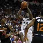 San Antonio Spurs' Will Cherry shoots over Phoenix Suns' Archie Goodwin (20) during the first half of an NBA summer league basketball game Monday, July 20, 2015, in Las Vegas. (AP Photo/John Locher)
