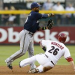  Arizona Diamondbacks' Miguel Montero (26) is forced out at second base by Milwaukee Brewers' Jean Segura, left, during the first inning of a baseball game on Tuesday, June 17, 2014, in Phoenix. (AP Photo/Ross D. Franklin)